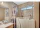 Accessible bathroom showcasing a walk-in tub, and neutral tile finishes for a spa-like feel at 2712 Peekskill Ave, Henderson, NV 89052
