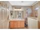 Accessible bathroom with a walk-in tub, vanity with mirror, and neutral tile finishes at 2712 Peekskill Ave, Henderson, NV 89052