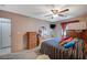Bedroom with carpet, dresser, TV, and furniture at 2712 Peekskill Ave, Henderson, NV 89052