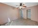 Comfortable bedroom with carpet flooring, ceiling fan, and closet at 2712 Peekskill Ave, Henderson, NV 89052