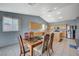 Open concept kitchen with tile floor, wood cabinetry, stainless appliances, and a dining area at 2712 Peekskill Ave, Henderson, NV 89052