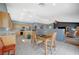 Spacious kitchen with a central island, wood cabinets, and an open layout to the dining and living areas at 2712 Peekskill Ave, Henderson, NV 89052