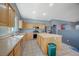 Kitchen featuring natural wood cabinets, center island, and tile flooring at 2712 Peekskill Ave, Henderson, NV 89052