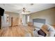 Inviting main bedroom showcasing wood floors, a ceiling fan, and a ensuite bathroom at 2712 Peekskill Ave, Henderson, NV 89052