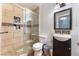 Modern bathroom featuring tiled walk-in shower and vanity with dark wood cabinet at 2732 Johannson Ln, Las Vegas, NV 89115
