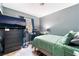 Bedroom with a large television, neutral walls, and natural light from the window at 2732 Johannson Ln, Las Vegas, NV 89115