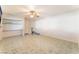 Open bedroom space with light walls, tile flooring, ceiling fan and closet at 2732 Johannson Ln, Las Vegas, NV 89115