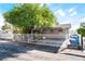 Charming single-story home featuring a metal fence, covered parking, and mature landscaping at 2732 Johannson Ln, Las Vegas, NV 89115