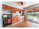 Traditional kitchen with wood cabinets, tile backsplash, and stainless steel oven range at 2732 Johannson Ln, Las Vegas, NV 89115