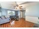 Comfortable living room with ceiling fan, wood-look tile floors, and cozy furniture at 2732 Johannson Ln, Las Vegas, NV 89115