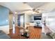 Inviting living room featuring wood-look tile flooring, modern decor, and natural light at 2732 Johannson Ln, Las Vegas, NV 89115