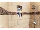 Close-up of bathroom walk-in shower with decorative tile and built-in shelving at 2732 Johannson Ln, Las Vegas, NV 89115