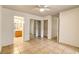 This bedroom features large closets, tile floors, and an open doorway to a full bathroom at 2801 N Rainbow Blvd # 102, Las Vegas, NV 89108