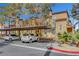 Exterior view showing covered parking and lush landscaping of these well maintained residential buildings at 2801 N Rainbow Blvd # 102, Las Vegas, NV 89108