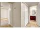 Hallway view to the bedroom and bathroom with tile flooring and a large closet on the right at 2801 N Rainbow Blvd # 102, Las Vegas, NV 89108