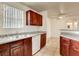 Bright kitchen with stainless steel sink, white dishwasher, and dark wood cabinetry at 2801 N Rainbow Blvd # 102, Las Vegas, NV 89108