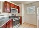 Updated kitchen offers stainless steel range, granite counters, and ample cabinet space at 2801 N Rainbow Blvd # 102, Las Vegas, NV 89108