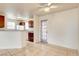Open-concept kitchen features wood cabinetry, tile flooring, and granite countertops at 2801 N Rainbow Blvd # 102, Las Vegas, NV 89108