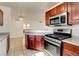 Beautiful kitchen view featuring granite countertops, stainless appliances, and dark cabinets at 2801 N Rainbow Blvd # 102, Las Vegas, NV 89108