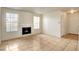 Bright living room with large windows, tile floors, and a cozy fireplace, perfect for relaxing or entertaining at 2801 N Rainbow Blvd # 102, Las Vegas, NV 89108
