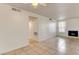 Spacious living room featuring tile flooring, neutral paint, and a fireplace for a cozy atmosphere at 2801 N Rainbow Blvd # 102, Las Vegas, NV 89108