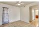 Living space with tile flooring leading to the bathroom and doorway with curtains at 2801 N Rainbow Blvd # 102, Las Vegas, NV 89108