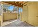Cozy covered patio with a gated entrance and neutral stucco walls at 2801 N Rainbow Blvd # 102, Las Vegas, NV 89108
