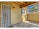 This is a covered patio with stucco walls and an iron security door at 2801 N Rainbow Blvd # 102, Las Vegas, NV 89108