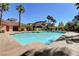 Relaxing pool area with palm trees and inviting, clear blue water at 2801 N Rainbow Blvd # 102, Las Vegas, NV 89108