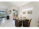 Cozy breakfast nook with large slider door and modern light fixture at 2962 Gettysburg Ave, Henderson, NV 89052