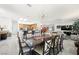 Open-concept dining room features modern chandelier and flows into the living area and kitchen at 2962 Gettysburg Ave, Henderson, NV 89052