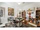 Bright living room with a game table, decorative shelving, and cozy seating at 2962 Gettysburg Ave, Henderson, NV 89052