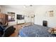 Comfortable main bedroom featuring hard floors, a ceiling fan, and a wall-mounted television at 2962 Gettysburg Ave, Henderson, NV 89052