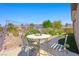 Cozy patio area with desert landscaping, ideal for outdoor dining and entertaining at 2962 Gettysburg Ave, Henderson, NV 89052
