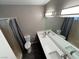 Neutral bathroom with dual sinks, shower, toilet and large mirror at 30 Diamond Cir, Las Vegas, NV 89106