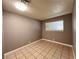 Neutral bedroom with window and tile floor at 30 Diamond Cir, Las Vegas, NV 89106