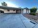 Charming single-story home with a spacious driveway and mature landscaping in a quiet neighborhood at 30 Diamond Cir, Las Vegas, NV 89106