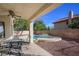 Outdoor dining area offering a serene space for meals and gatherings, overlooking the sparkling pool at 3000 Waterview Dr, Las Vegas, NV 89117
