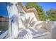 Outdoor balcony featuring stucco walls and views of nearby houses with red tile roofing at 3000 Waterview Dr, Las Vegas, NV 89117