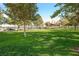 Inviting community park with lush green grass, mature trees, and a covered gazebo for gatherings at 3000 Waterview Dr, Las Vegas, NV 89117