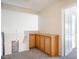 Hallway alcove with built in wooden cabinets, carpet flooring and a view of the stairs at 3000 Waterview Dr, Las Vegas, NV 89117