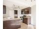 Modern kitchen features stainless steel appliances, granite countertops, and dark wood cabinetry at 3000 Waterview Dr, Las Vegas, NV 89117