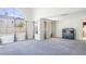 Bright living room featuring expansive windows and neutral carpet, ideal for modern living at 3000 Waterview Dr, Las Vegas, NV 89117