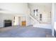 Spacious living room with high ceilings, neutral paint, and plush carpeting, bathed in natural light at 3000 Waterview Dr, Las Vegas, NV 89117