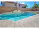 Inviting backyard pool and spa combination with a tiled deck, perfect for relaxation and outdoor enjoyment at 3000 Waterview Dr, Las Vegas, NV 89117