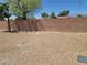Gravel backyard featuring a brick wall and privacy at 3012 Silver Canyon Ln, North Las Vegas, NV 89031