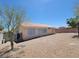 View of the property's rear exterior and backyard, showcasing desert landscaping at 3012 Silver Canyon Ln, North Las Vegas, NV 89031
