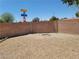 Gravel backyard featuring a brick wall and privacy at 3012 Silver Canyon Ln, North Las Vegas, NV 89031