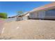 Open backyard featuring desert landscaping and a privacy wall at 3012 Silver Canyon Ln, North Las Vegas, NV 89031