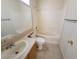 A standard bathroom includes a shower-tub combo, vanity and neutral colored walls at 3012 Silver Canyon Ln, North Las Vegas, NV 89031